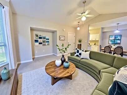 1501 N Partin Dr Unit 216, Niceville, FL 32578 - carpeted living area featuring ceiling fan, baseboards, and vaulted ceiling