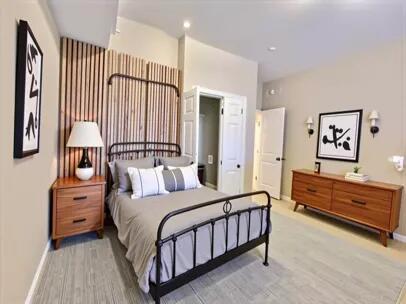 1501 N Partin Dr Unit 216, Niceville, FL 32578 - bedroom with baseboards and light wood-style floors