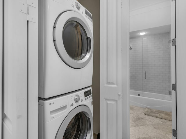 laundry room featuring stacked washer / dryer