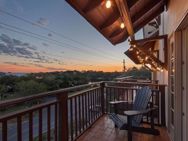 view of balcony at dusk