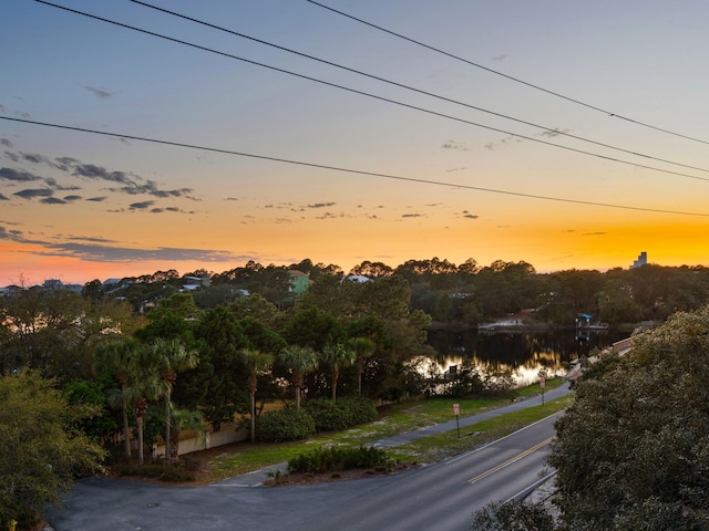 view of asphalt street featuring a water view