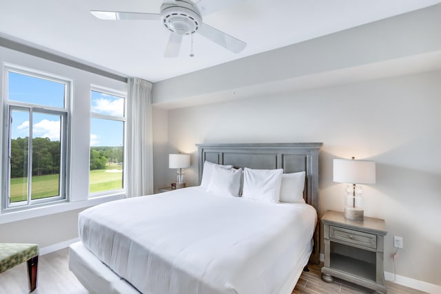 9800 Grand Sandestin Blvd Unit 5410/5412, Miramar Beach, FL 32550 - bedroom featuring light wood-type flooring, baseboards, and ceiling fan