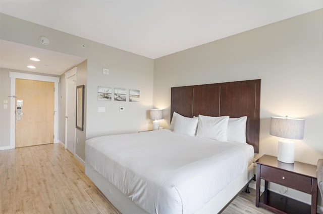9800 Grand Sandestin Blvd Unit 5410/5412, Miramar Beach, FL 32550 - bedroom featuring light wood-type flooring and baseboards