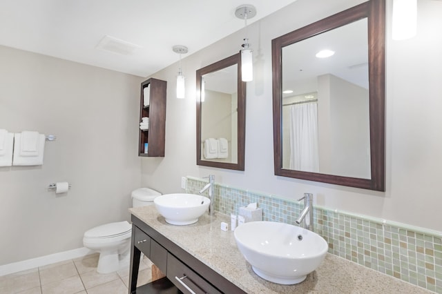 9800 Grand Sandestin Blvd Unit 5410/5412, Miramar Beach, FL 32550 - full bathroom with toilet, tile patterned flooring, double vanity, baseboards, and tasteful backsplash