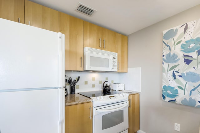 9800 Grand Sandestin Blvd Unit 5410/5412, Miramar Beach, FL 32550 - kitchen featuring white appliances, decorative backsplash, and light stone counters