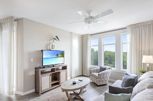 9800 Grand Sandestin Blvd Unit 5410/5412, Miramar Beach, FL 32550 - living room featuring baseboards, wood finished floors, and a ceiling fan