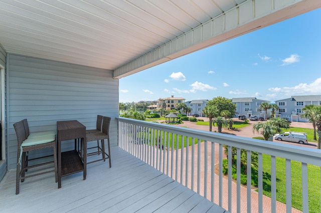 wooden deck featuring a residential view