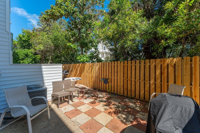 view of patio / terrace featuring a fenced backyard and central AC unit