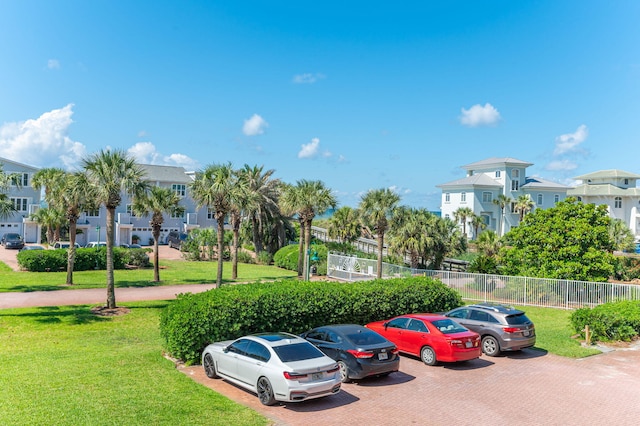 uncovered parking lot with a residential view