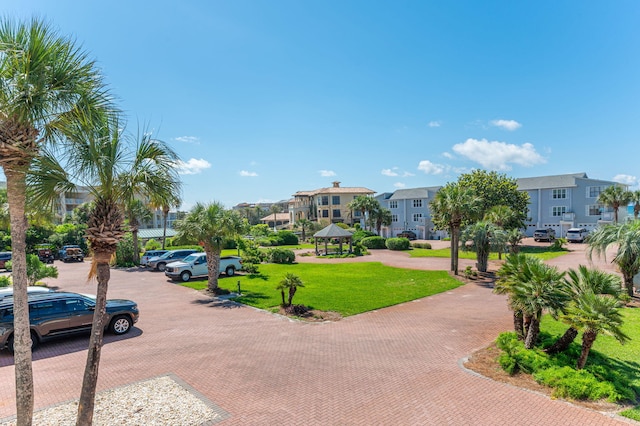 surrounding community featuring a residential view, a gazebo, and a lawn