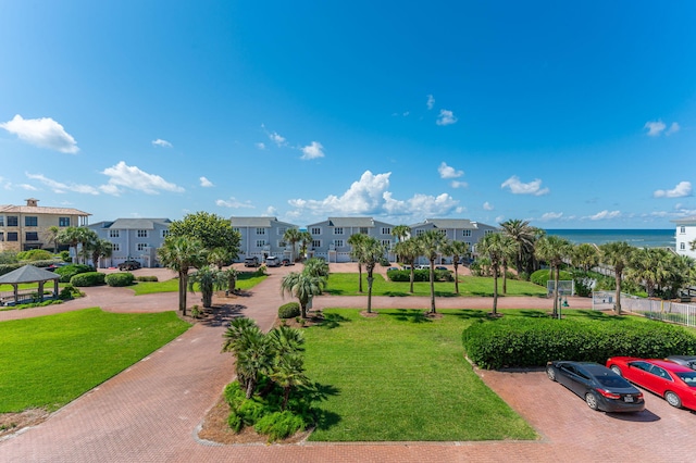 view of home's community featuring a gazebo, a residential view, and a lawn