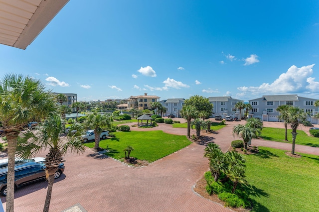 view of home's community featuring a residential view, a lawn, and a gazebo