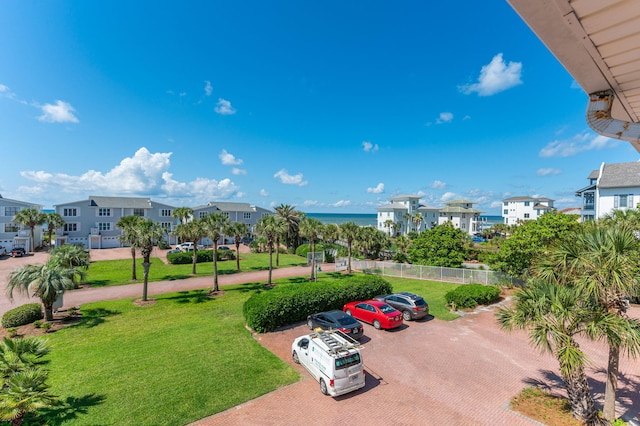 surrounding community with a residential view and uncovered parking