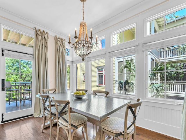 dining room featuring a chandelier and dark wood-style flooring