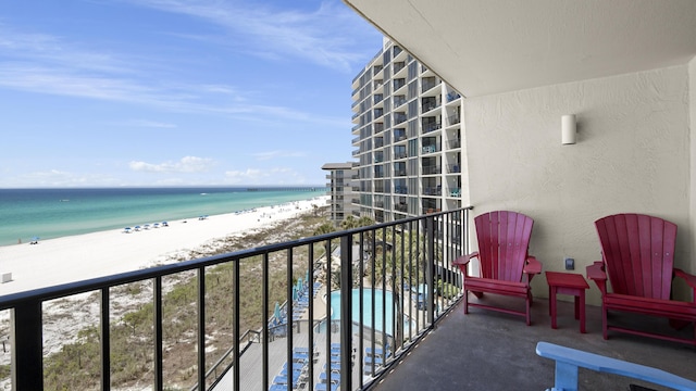 balcony featuring view of water and beach