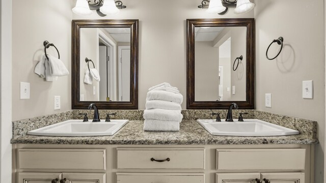 full bathroom featuring double vanity