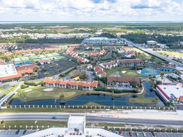 bird's eye view of a nearby body of water and a local golf course
