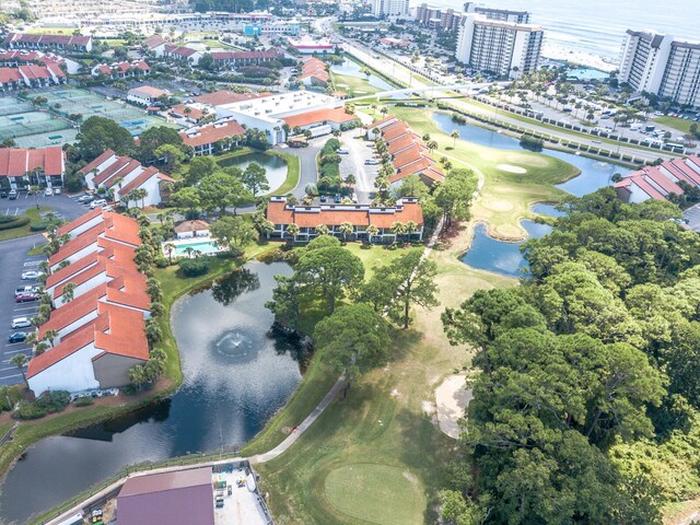 view of property location with a large body of water, a local golf course, and apartment complex