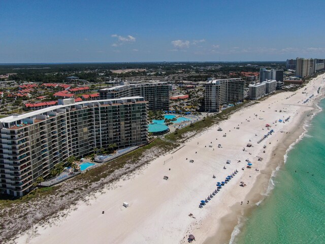 view of urban area featuring extended coastline and a pool area