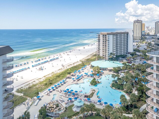 bird's eye view of expansive coastline and a pool area