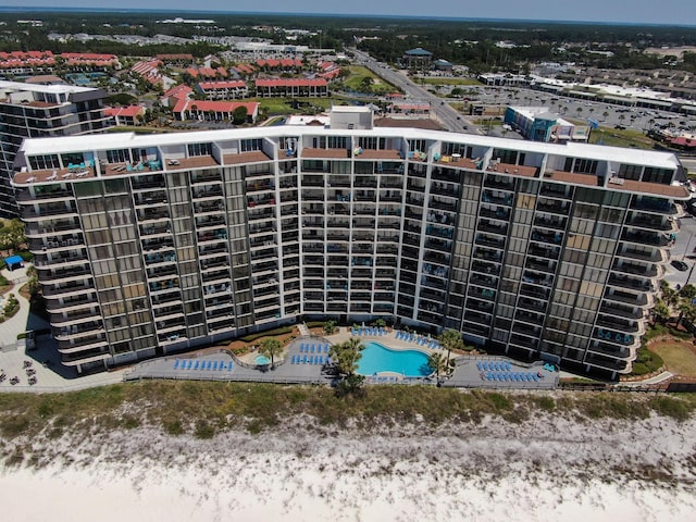 drone / aerial view of apartment complex and a pool area