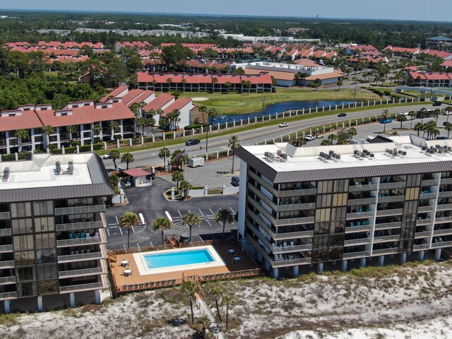 drone / aerial view of apartment complex and a pool