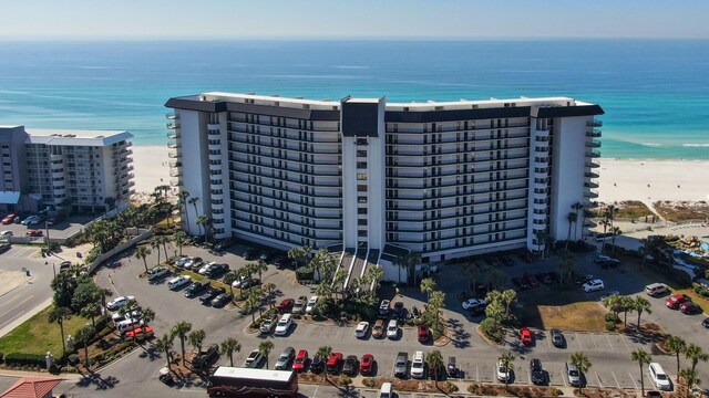 drone / aerial view of extended coastline and apartment complex / building