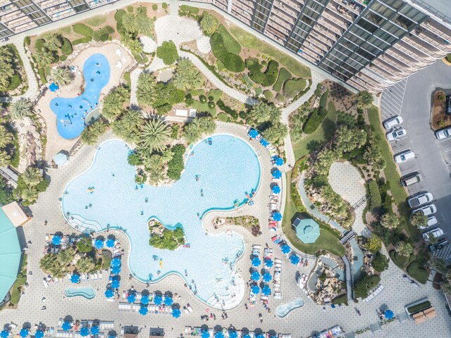 view of property location with a pool area