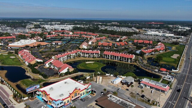 aerial overview of property's location featuring a large body of water and a golf course