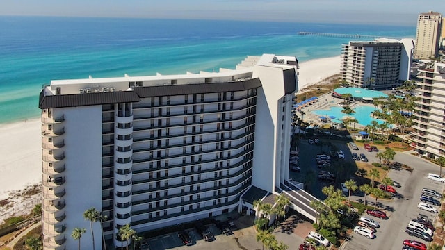 bird's eye view of unending shoreline and a pool