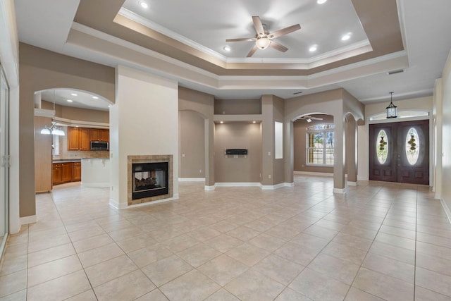 1049 Napa Way, Niceville, FL 32578 - entrance foyer with a tray ceiling, arched walkways, ceiling fan, light tile patterned floors, and recessed lighting
