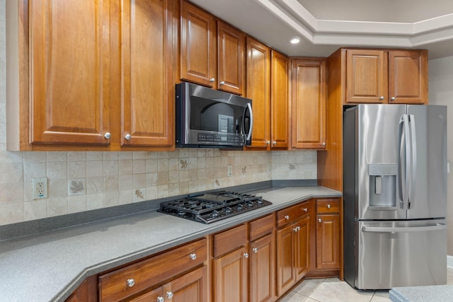 1049 Napa Way, Niceville, FL 32578 - kitchen featuring stainless steel fridge with ice dispenser, black gas stovetop, and brown cabinets