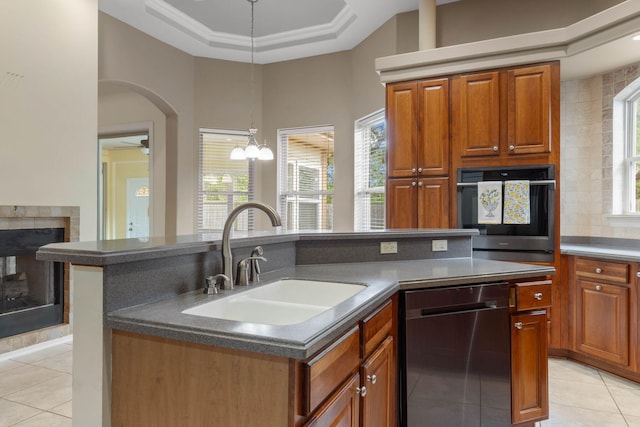 1049 Napa Way, Niceville, FL 32578 - kitchen with dishwasher, wall oven, a sink, light tile patterned flooring, and dark countertops
