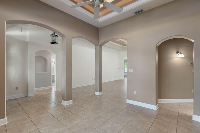 1049 Napa Way, Niceville, FL 32578 - unfurnished room featuring a ceiling fan, light tile patterned floors, arched walkways, and baseboards