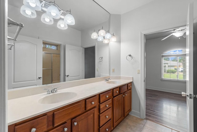 1049 Napa Way, Niceville, FL 32578 - bathroom with tile patterned flooring, healthy amount of natural light, double vanity, and a shower with door