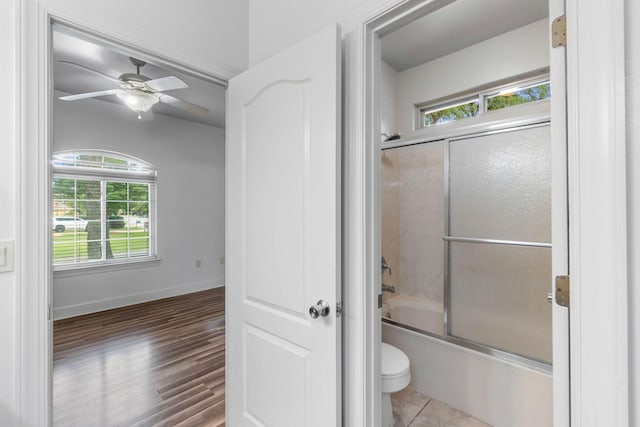 1049 Napa Way, Niceville, FL 32578 - bathroom with toilet, healthy amount of natural light, shower / bath combination with glass door, and ceiling fan