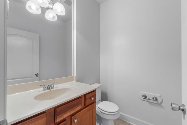 1049 Napa Way, Niceville, FL 32578 - bathroom featuring toilet, vanity, tile patterned floors, and baseboards