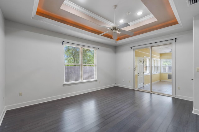 1049 Napa Way, Niceville, FL 32578 - unfurnished room featuring a raised ceiling, ceiling fan, dark wood-style flooring, ornamental molding, and baseboards