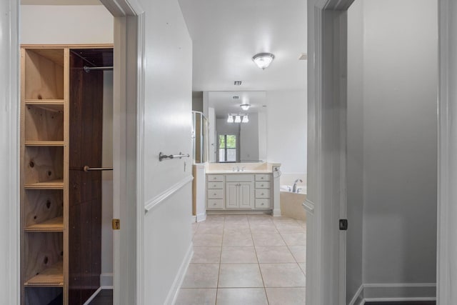 1049 Napa Way, Niceville, FL 32578 - full bath with vanity, tile patterned floors, a garden tub, baseboards, and a shower with door