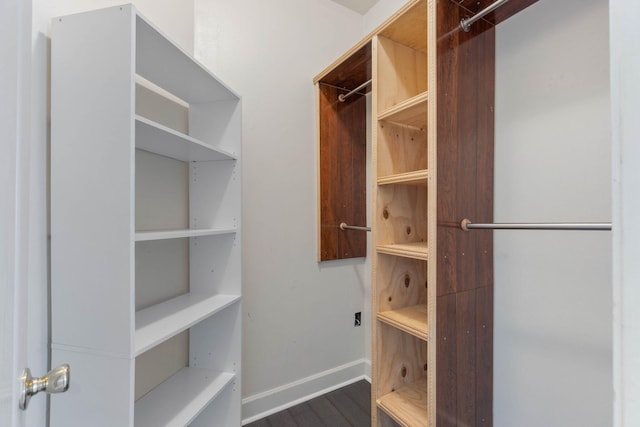 1049 Napa Way, Niceville, FL 32578 - walk in closet featuring dark wood finished floors