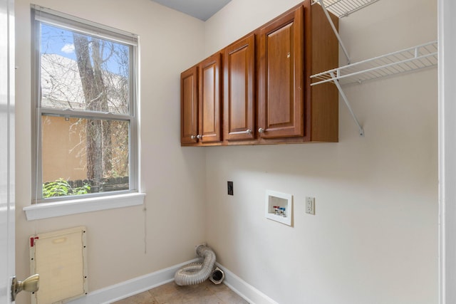 1049 Napa Way, Niceville, FL 32578 - laundry area featuring washer hookup, cabinet space, hookup for an electric dryer, baseboards, and tile patterned flooring