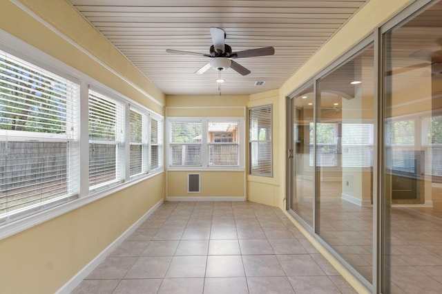 1049 Napa Way, Niceville, FL 32578 - unfurnished sunroom featuring healthy amount of natural light, a ceiling fan, tile patterned flooring, and wood ceiling