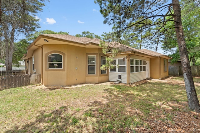 1049 Napa Way, Niceville, FL 32578 - rear view of property featuring stucco siding and a shingled roof