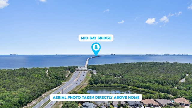1049 Napa Way, Niceville, FL 32578 - drone / aerial view of a nearby body of water, a main thoroughfare, and a heavily wooded area
