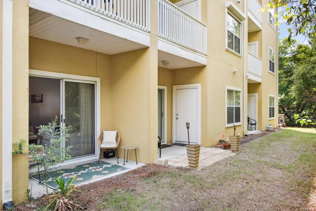 34 Herons Watch Way Unit 1102, Santa Rosa Beach, FL 32459 - back of property with stucco siding and a patio