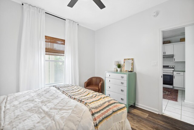 34 Herons Watch Way Unit 1102, Santa Rosa Beach, FL 32459 - bedroom with dark wood-style flooring, baseboards, and a ceiling fan