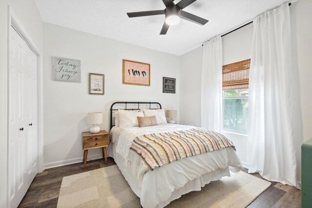 34 Herons Watch Way Unit 1102, Santa Rosa Beach, FL 32459 - bedroom featuring dark wood finished floors, a closet, a ceiling fan, and baseboards