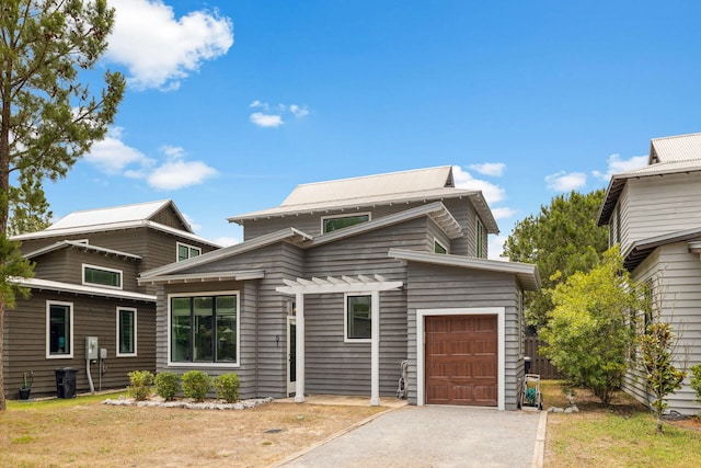 view of front of home featuring a garage and driveway