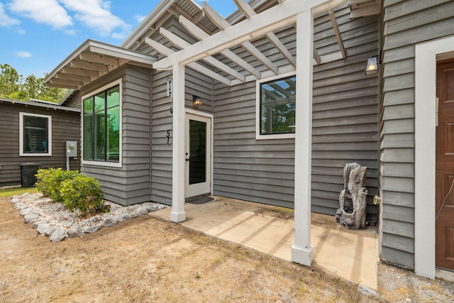 property entrance featuring a patio