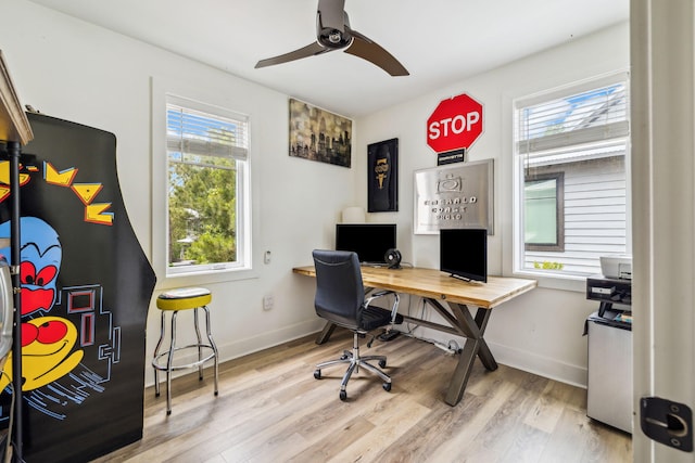 office area featuring wood finished floors, ceiling fan, and baseboards